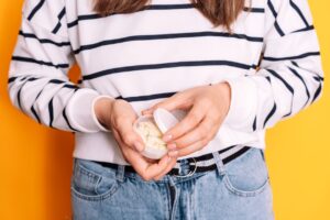 A woman holding what could be zyn nicotine pouches