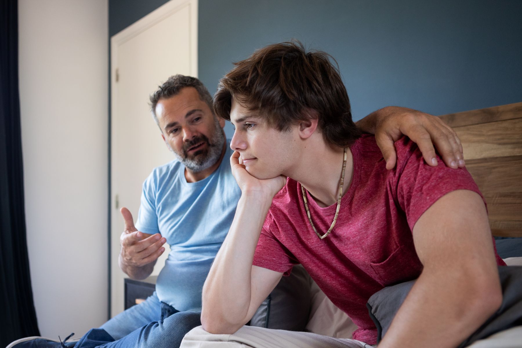 A parent talking to his teenage son, asking a question many parents ask - is my teen's drinking a problem?