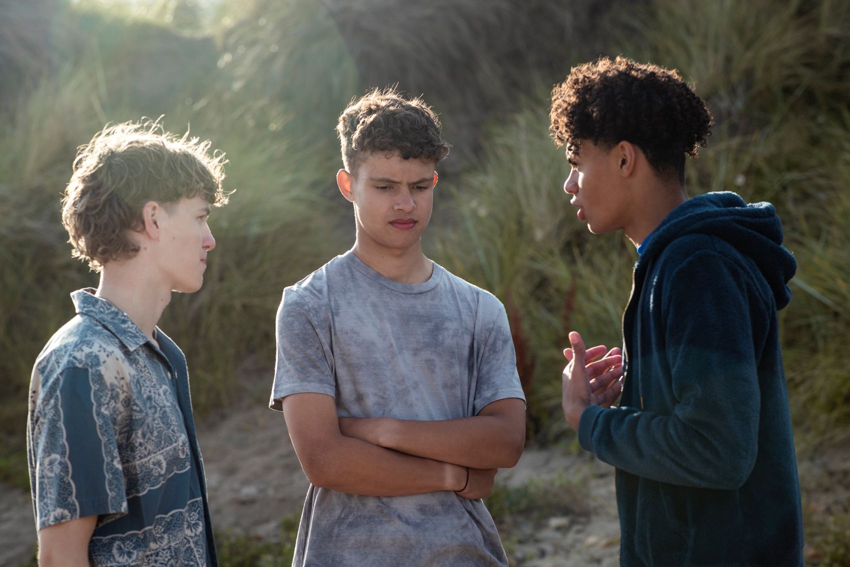 Three boys having a tense conversation, representing how to say no to drugs and alcohol