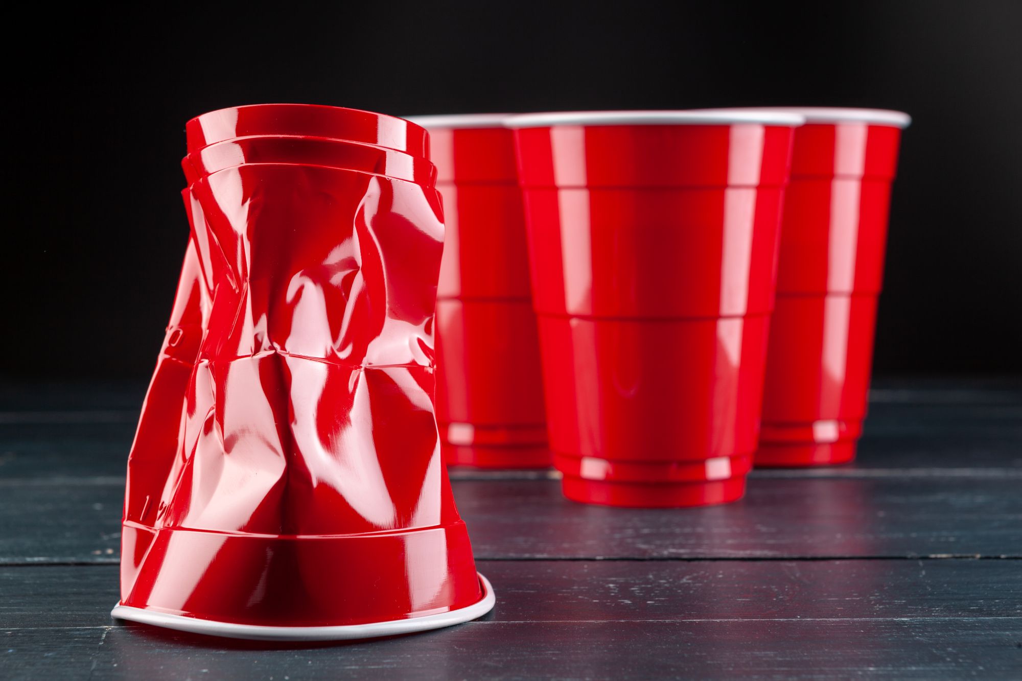 A set of beer pong cups, representing the risks of high-intensity drinking