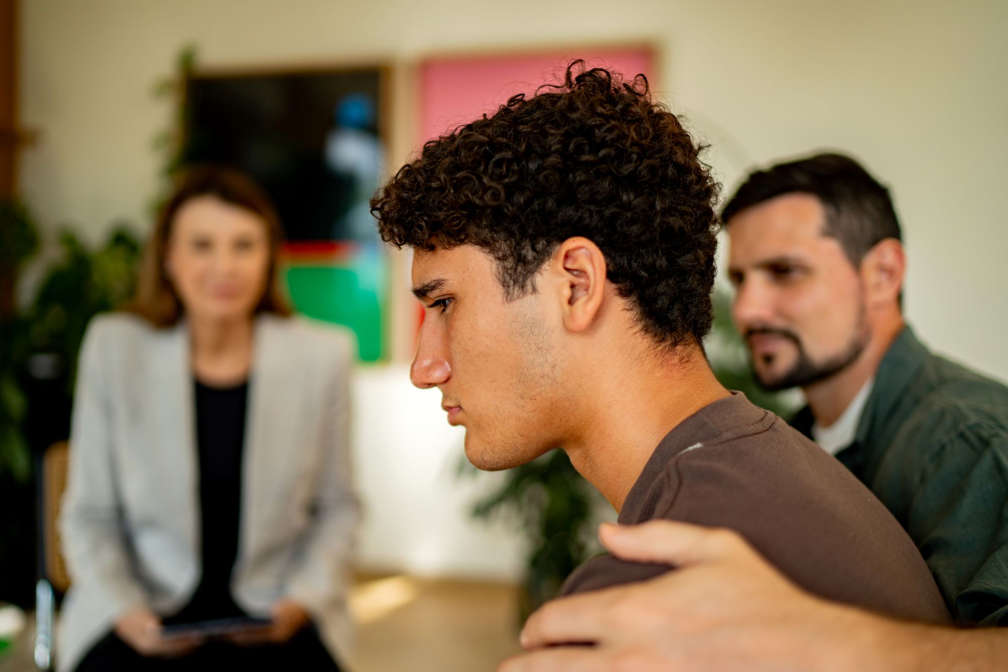 A young man in the principal's office, where parents might be asking about how my child got caught vaping