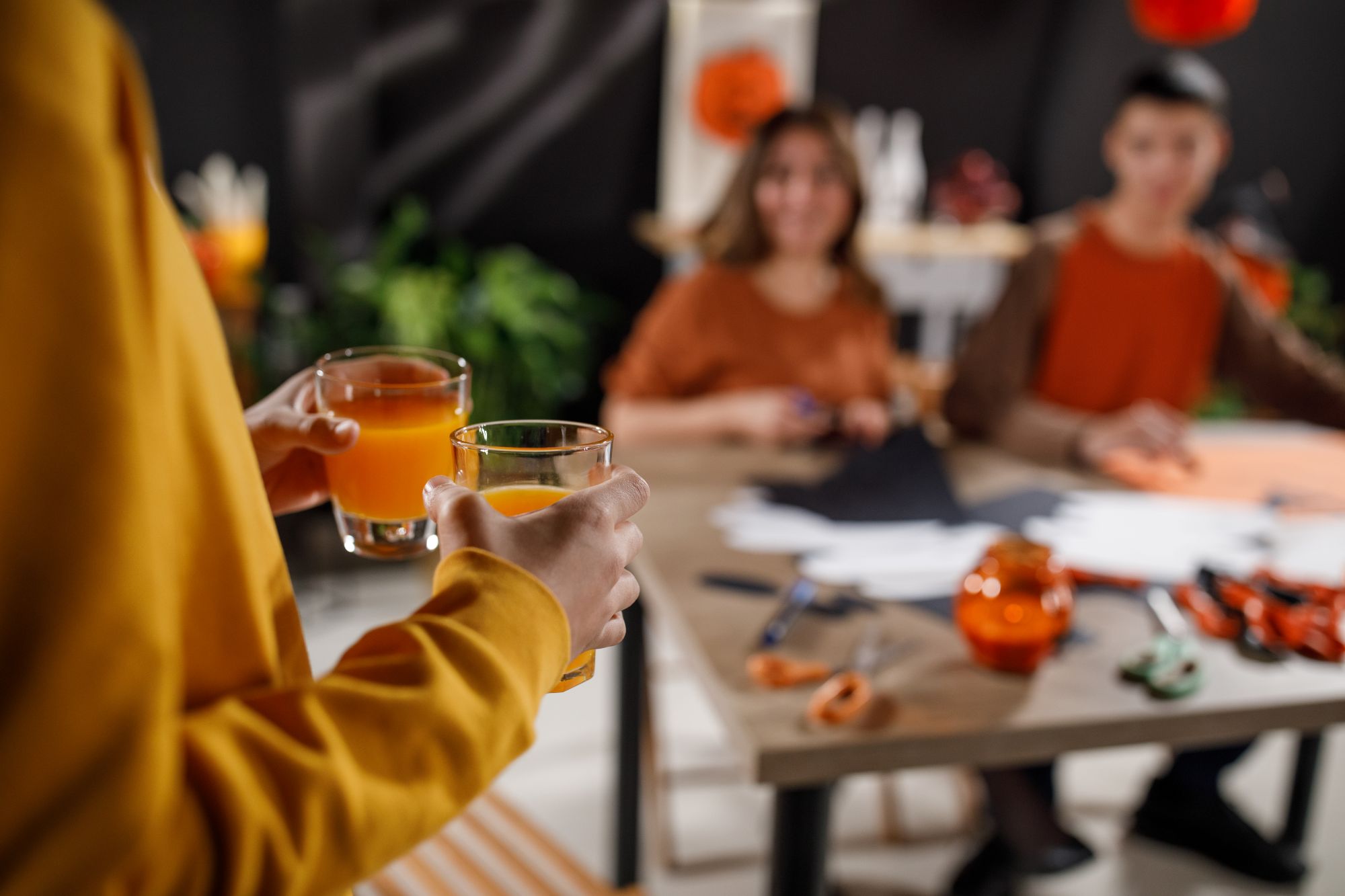 A person serving drinks at a party, representing social host liability laws