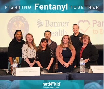 Group photo of individuals at notMyKid event
