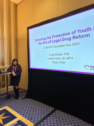 Image individual presenting at conference